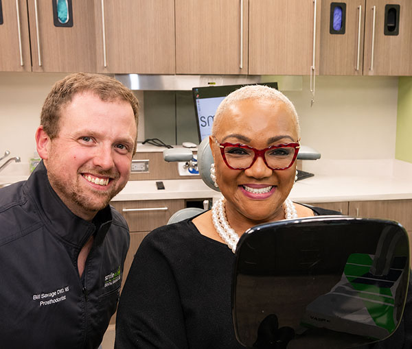 happy dental implant patient with dr